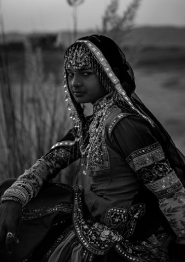 Black and White Photography with the title 'India 9'. Portrait of an Indian Girl in traditional Costume.