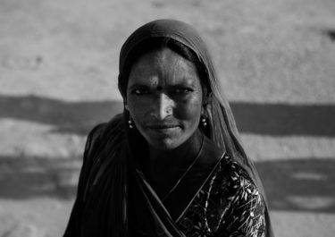 Black and White Photography with the title 'India 14'. Portrait of an Indian woman with a headscarf.